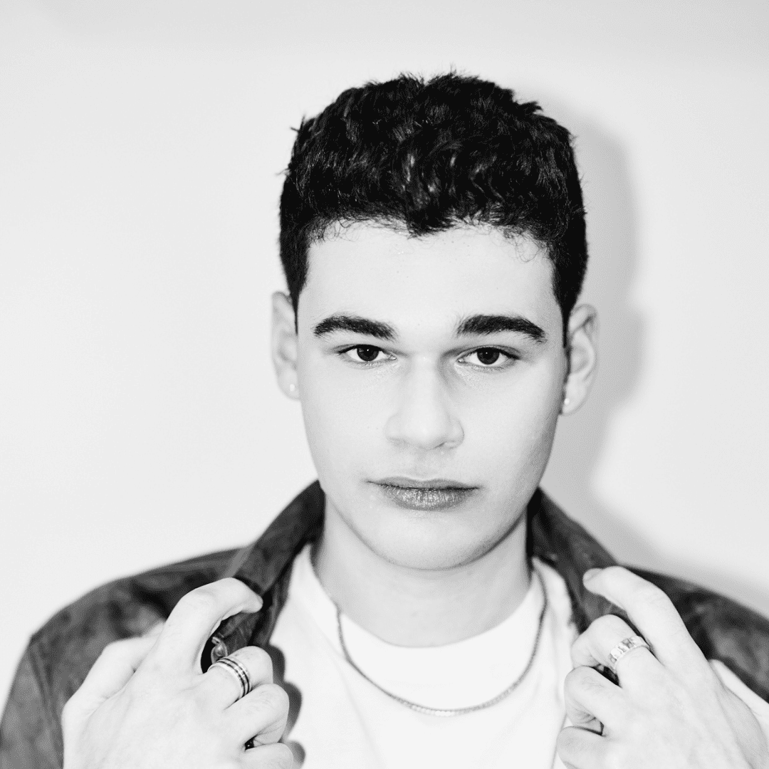 Portrait of Eli Goodman, a professional stylist at Matthew Morris Salon, showcasing their expertise and style.