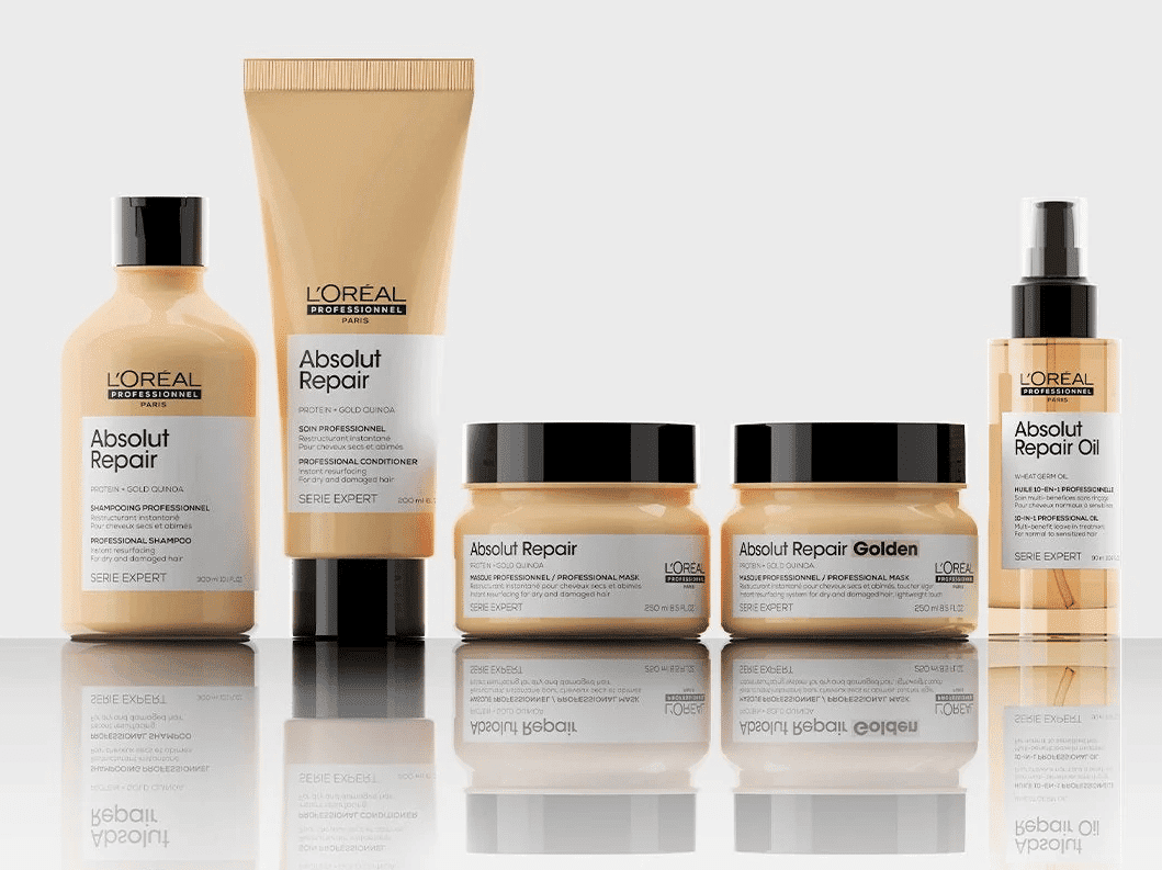 L'Oreal Absolut Repair haircare product set, including shampoo, conditioner, and oil.