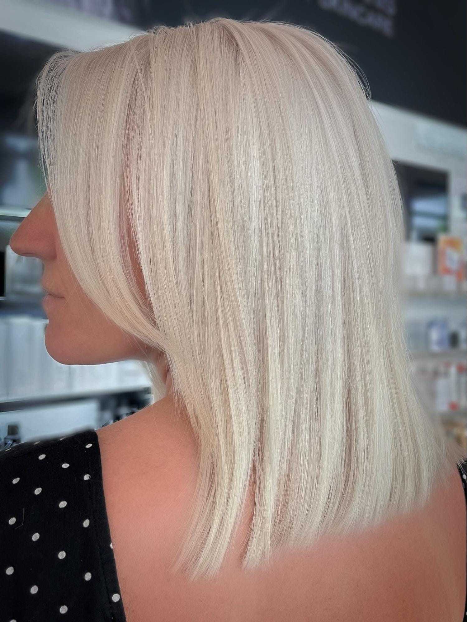 Blonde hair with a sleek, straight bob haircut, viewed from the back and side.