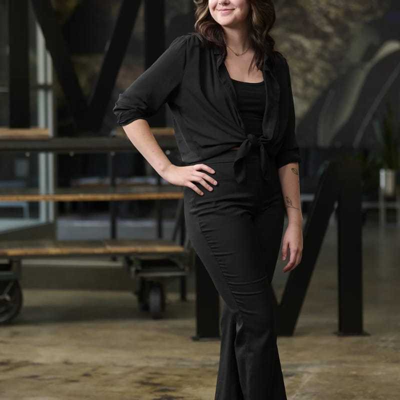 Portrait of Sydney Trevino, a professional stylist at Matthew Morris Salon, showcasing their expertise and style.
